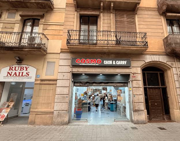 Cosmo Cash & Carry storefront at Ronda Sant Antoni 11, beside Ruby Nails